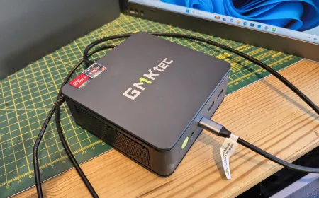 The compact GMKtec M5 Ultra Mini PC is displayed from the front and rear, highlighting its dual gigabit Ethernet ports.