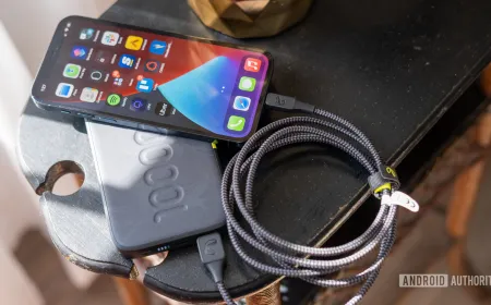 Smartphones connected to USB-C charging cables demonstrating standardized power delivery