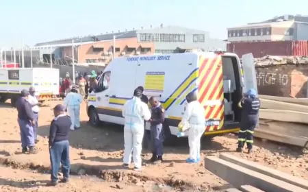 Police secure a crime scene in a Johannesburg informal settlement after a deadly armed attack.
