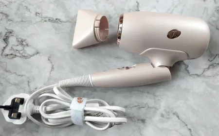 This compact travel hair dryer features adjustable heat settings and universal voltage compatibility.