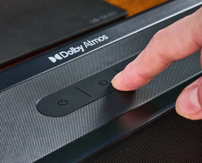 Audio engineers adjust mixing consoles for Dolby Atmos soundtracks.